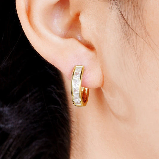 “Classic hoop earrings with princess-cut CZ, elegant and versatile women’s accessories.”