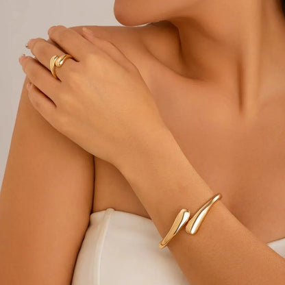 “Ingemark Creative Water Drop Metal Bangle - Gold Geometric Twisted Bracelet for Women.”