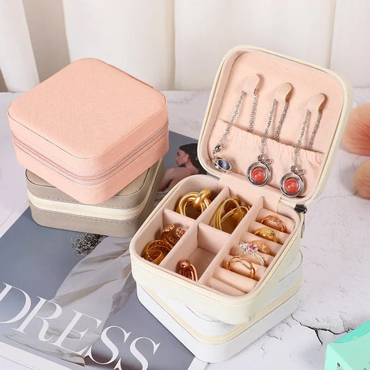 “Portable mini jewelry storage box, PU leather, for earrings, necklaces, rings.”