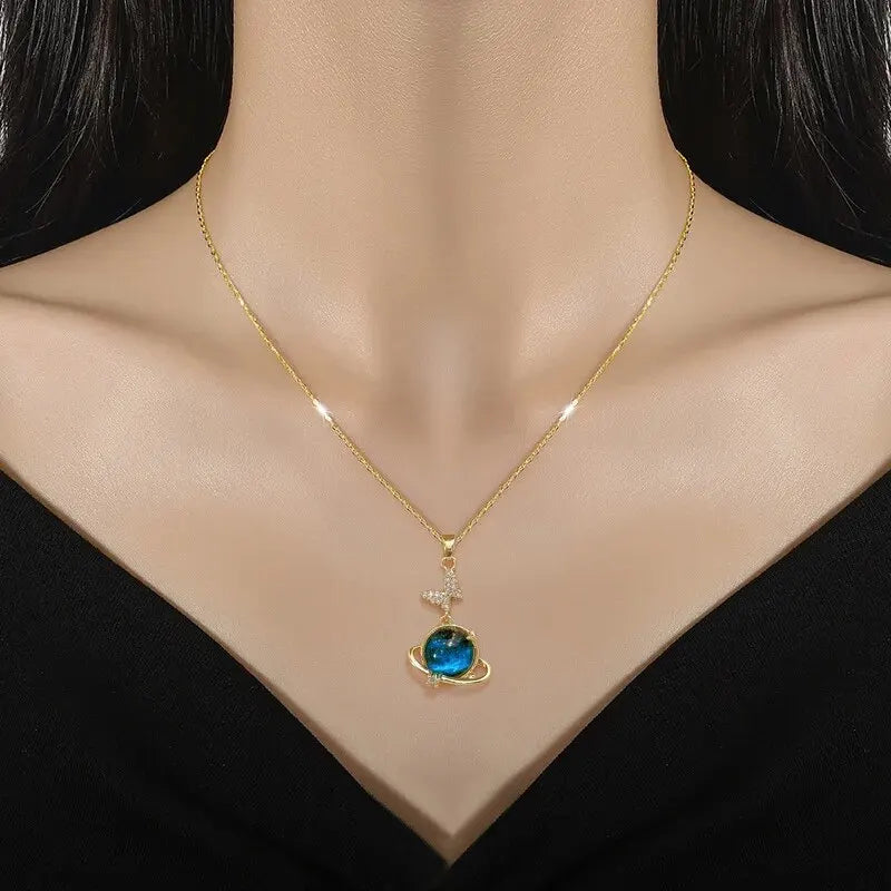 “Luxury gold titanium steel necklace with planet, moon, astronaut pendants.”