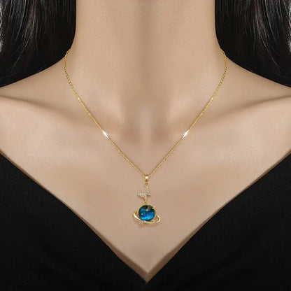 “Luxury gold titanium steel necklace with planet, moon, astronaut pendants.”