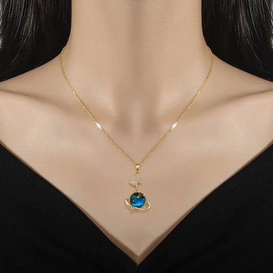 “Luxury gold titanium steel necklace with planet, moon, astronaut pendants.”