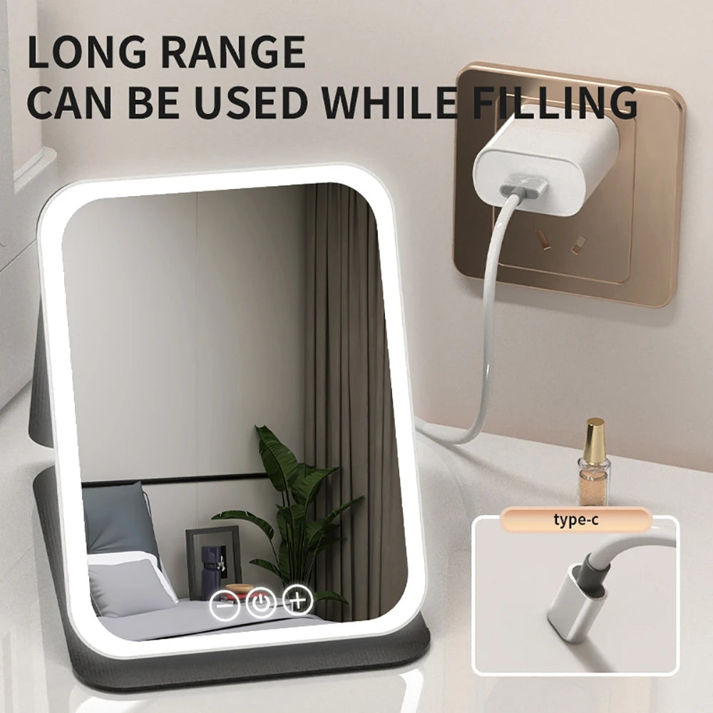 "3 Colors dimmable LED makeup mirror with touch screen, foldable, rechargeable, travel-friendly."