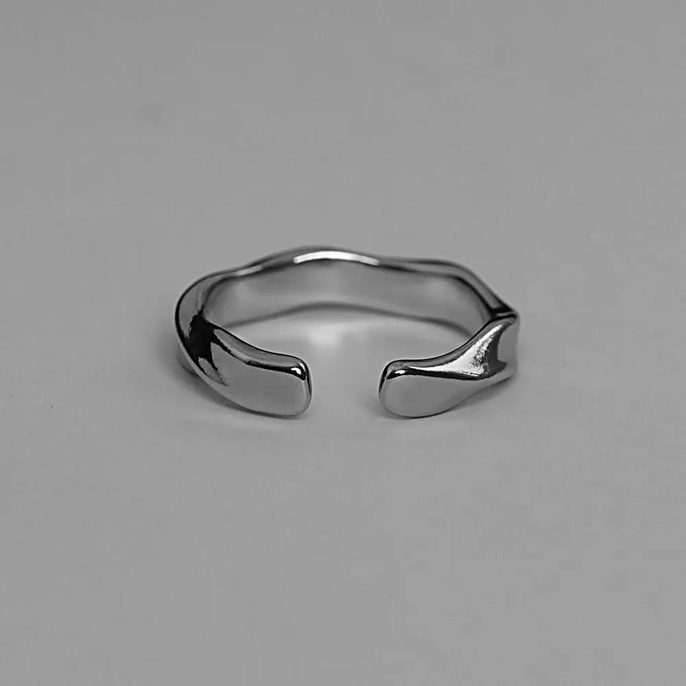 “Mobius Wave Ring - Silver Color Alloy Open Ring for Women & Men, Retro Style.”