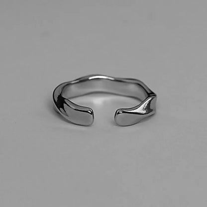 “Mobius Wave Ring - Silver Color Alloy Open Ring for Women & Men, Retro Style.”