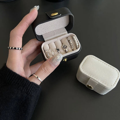 “Mini Portable Jewelry Storage Bag Leather Travel Box for Rings, Necklaces, Earrings.”