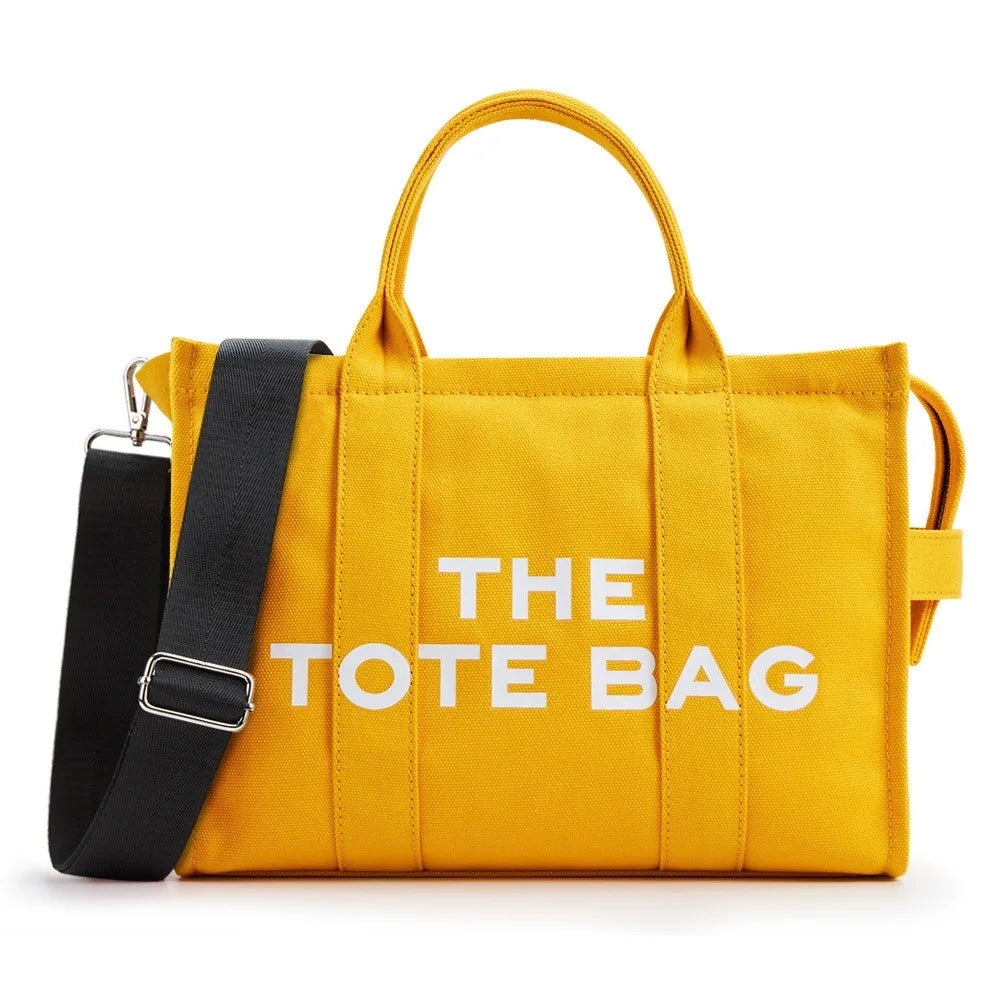 “Designer canvas tote bag, large capacity, adjustable shoulder strap, crossbody style.”