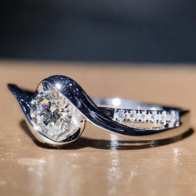 “Elegant 925 silver promise ring with solitaire zircon, perfect bridal jewelry.”