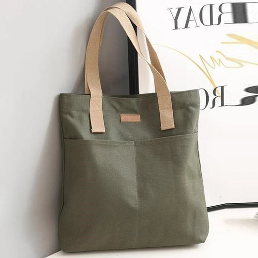 “Women’s solid color canvas tote bag, large capacity, casual, reusable, beach shopping.”