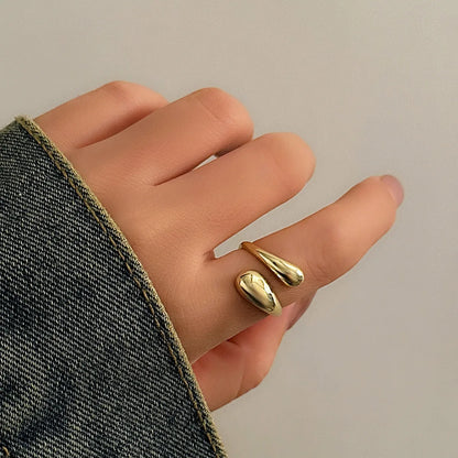 “Ingemark Creative Water Drop Metal Bangle - Gold Geometric Twisted Bracelet for Women.”