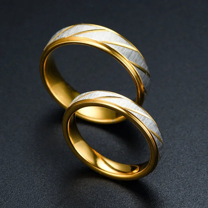 “Gold wave-pattern couple rings, stainless steel, perfect for weddings or promises.”