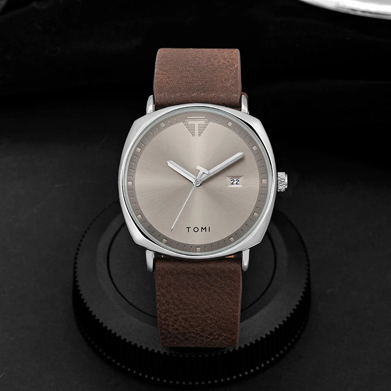“Minimalist men’s sports watch with calendar, leather strap, casual quartz movement.”