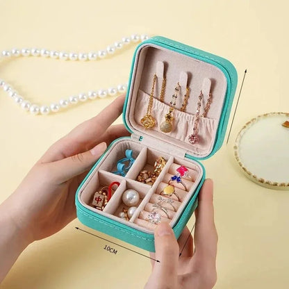 “Portable mini jewelry storage box, PU leather, for earrings, necklaces, rings.”
