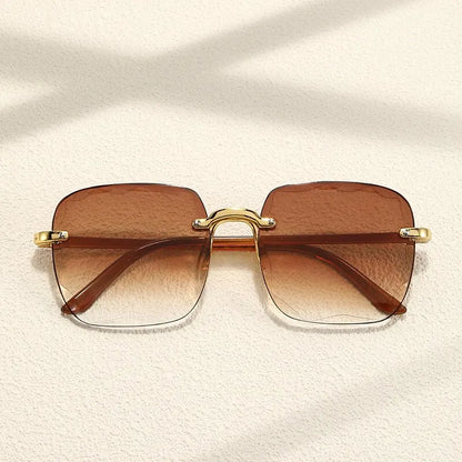 “Square frameless women’s sunglasses with classic gradient lenses.”