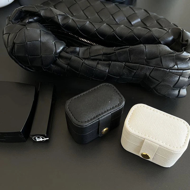 “Mini Portable Jewelry Storage Bag Leather Travel Box for Rings, Necklaces, Earrings.”