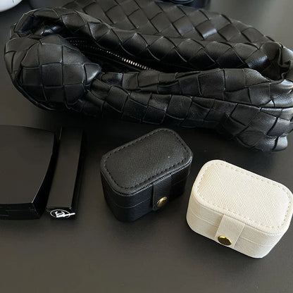 “Mini Portable Jewelry Storage Bag Leather Travel Box for Rings, Necklaces, Earrings.”