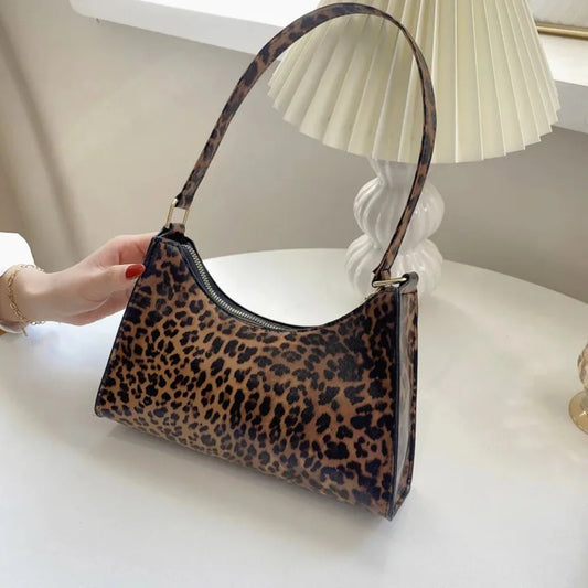 “Trendy zebra-print shoulder bag, PU leather, chic design, perfect summer accessory.”
