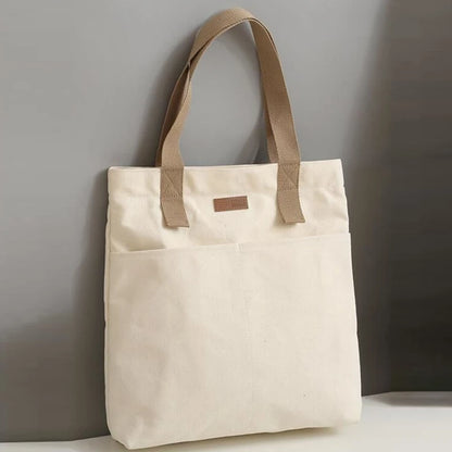 “Women’s solid color canvas tote bag, large capacity, casual, reusable, beach shopping.”
