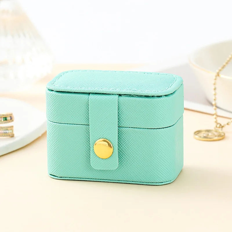 “Mini Portable Jewelry Storage Bag Leather Travel Box for Rings, Necklaces, Earrings.”