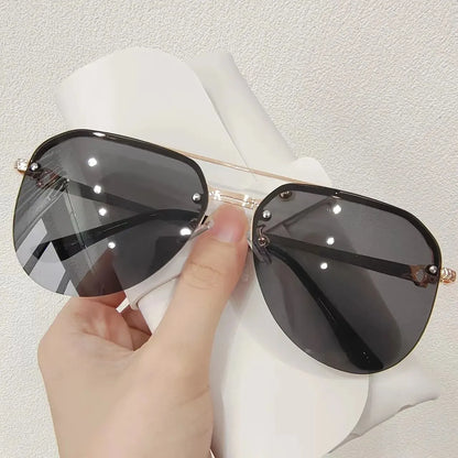 “Metal half-frame women’s sunglasses, classic double-beam design for outdoor fashion.”
