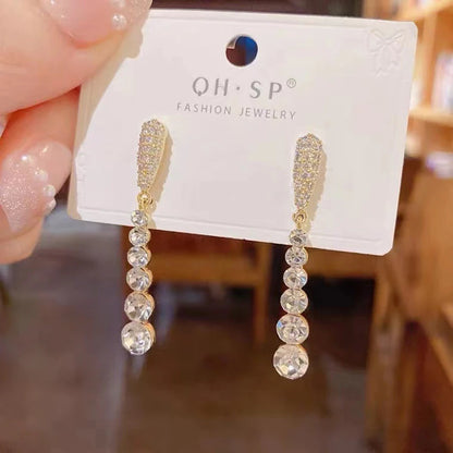 “Korean Tassel Pearl Drop Earrings - Luxury Gold Wedding Jewelry.”