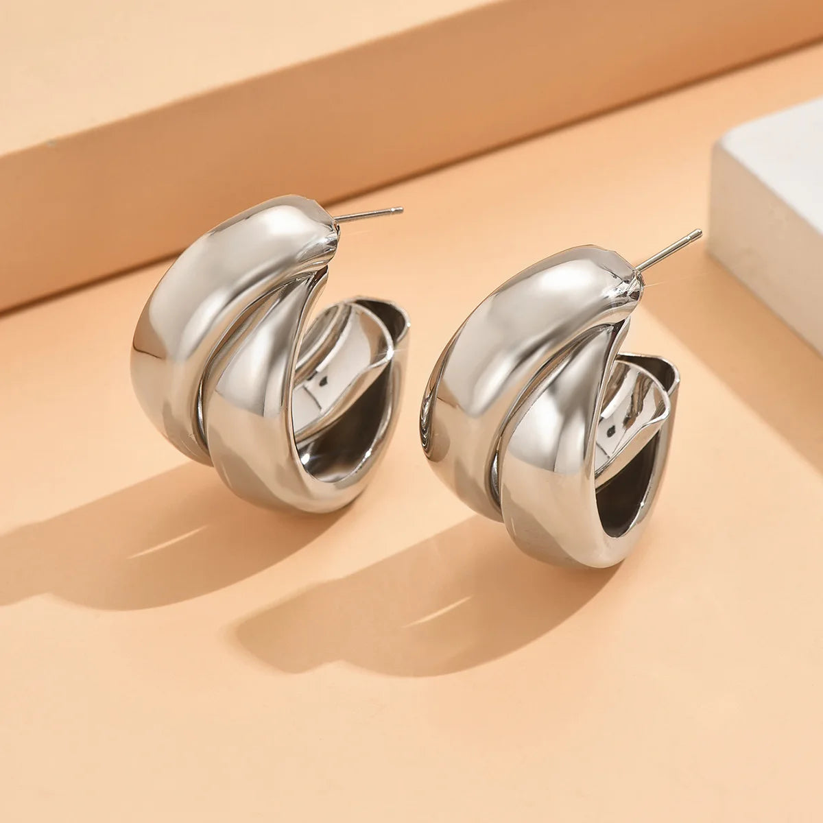 “Stainless Steel Chunky Hoop Earrings - Gold Double Ring Geometric Design.”