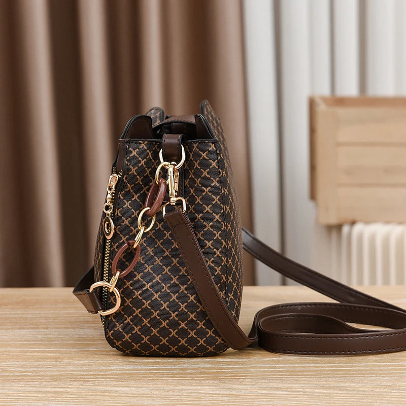 “Luxury bucket handbag for women, check print, spacious design, crossbody style.”
