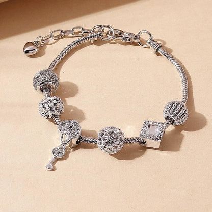 “Fashion rose and swan charm bracelet, elegant accessory for parties or daily wear.”