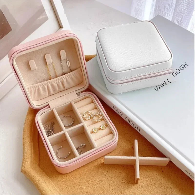 “Portable mini jewelry storage box, PU leather, for earrings, necklaces, rings.”