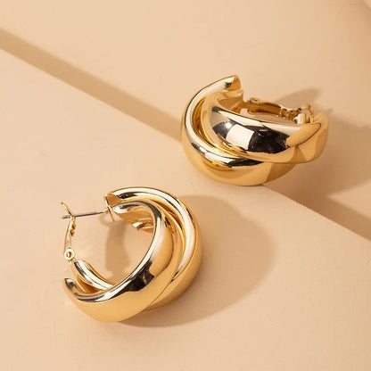 “Stainless Steel Chunky Hoop Earrings - Gold Double Ring Geometric Design.”