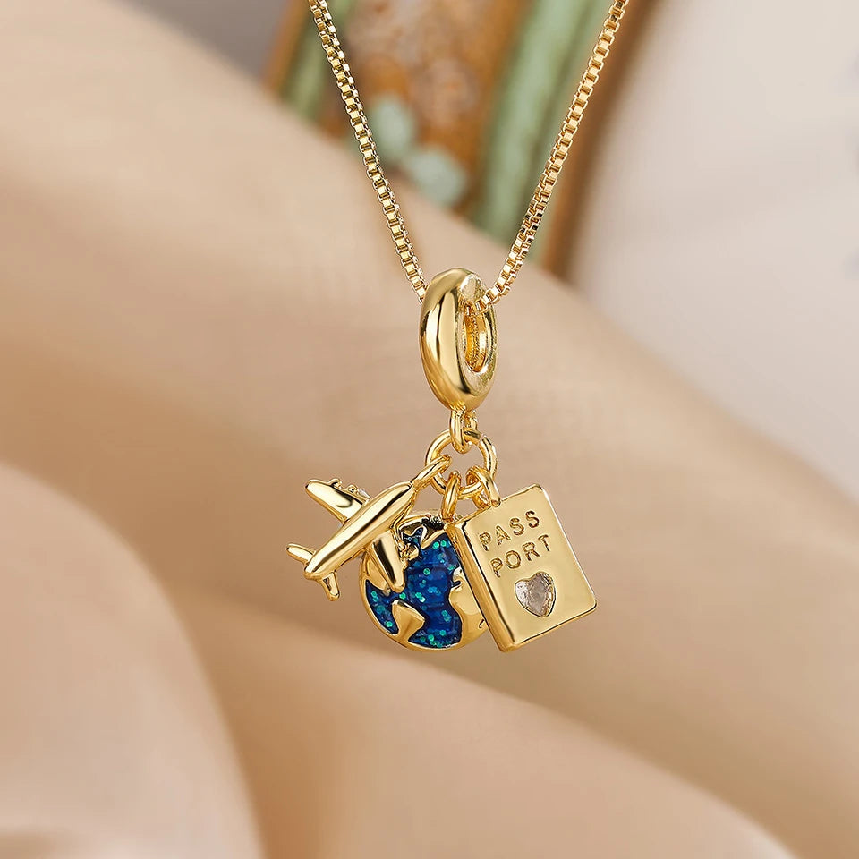 “Luxury gold titanium steel necklace with planet, moon, astronaut pendants.”