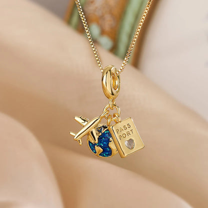 “Luxury gold titanium steel necklace with planet, moon, astronaut pendants.”