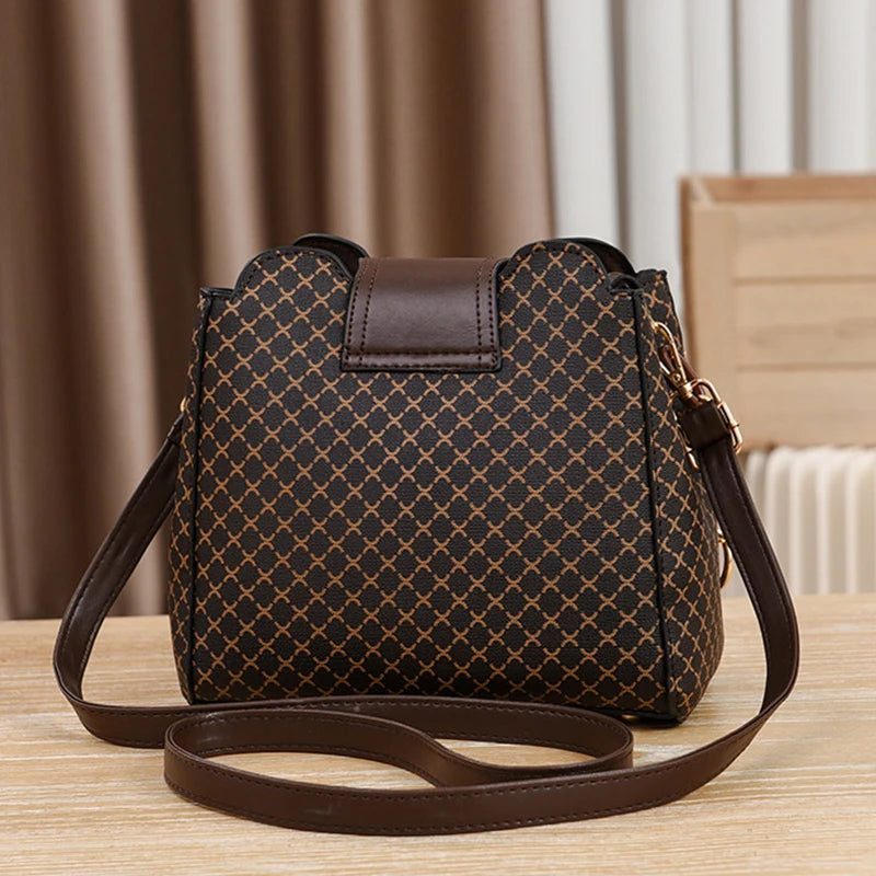 “Luxury bucket handbag for women, check print, spacious design, crossbody style.”