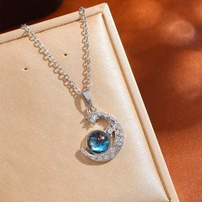 “Luxury gold titanium steel necklace with planet, moon, astronaut pendants.”