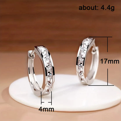 “Classic hoop earrings with princess-cut CZ, elegant and versatile women’s accessories.”