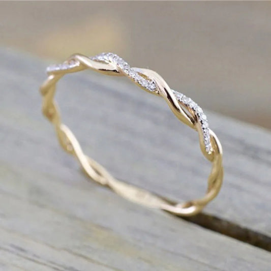 “Huitan Simple Stylish Thin Rings - Twist Band with Shiny CZ for Daily Wear.”
