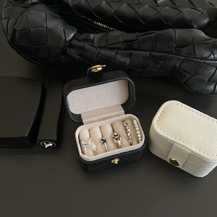“Mini Portable Jewelry Storage Bag Leather Travel Box for Rings, Necklaces, Earrings.”