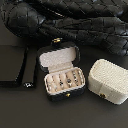“Mini Portable Jewelry Storage Bag Leather Travel Box for Rings, Necklaces, Earrings.”