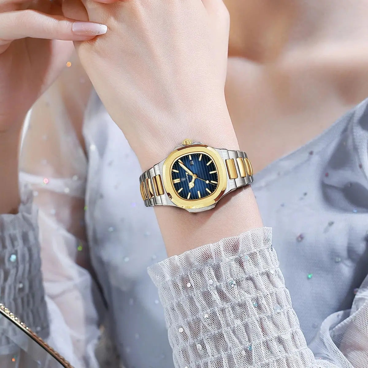 “Luxury waterproof square women’s watch with luminous date, stainless steel, quartz movement.”