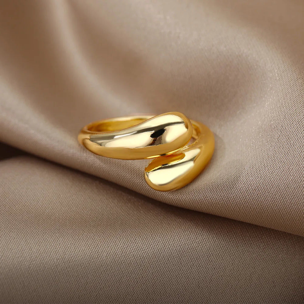 “Trendy Gold Stainless Steel Rings for Women - Perfect Wedding & Couple Jewelry.”