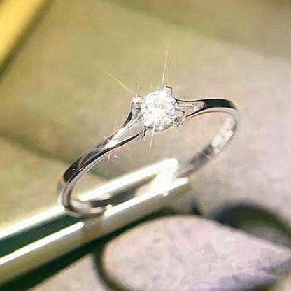“Minimalist wedding ring with 4MM cubic zirconia, simple and elegant design.”
