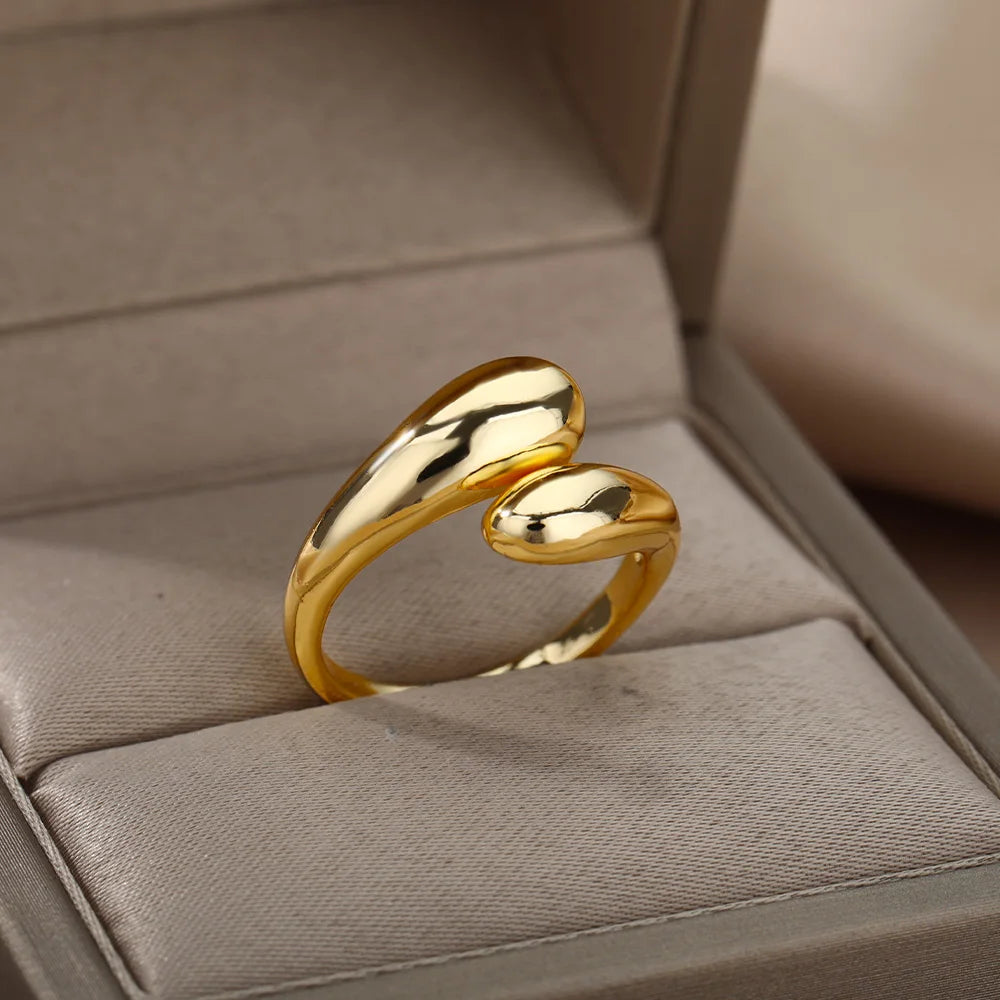 “Trendy Gold Stainless Steel Rings for Women - Perfect Wedding & Couple Jewelry.”