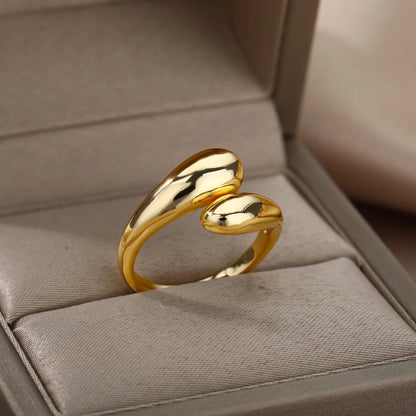 “Trendy Gold Stainless Steel Rings for Women - Perfect Wedding & Couple Jewelry.”