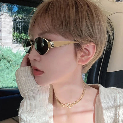 “UV400 oval sunglasses, unisex alloy frame, stylish and protective design.”