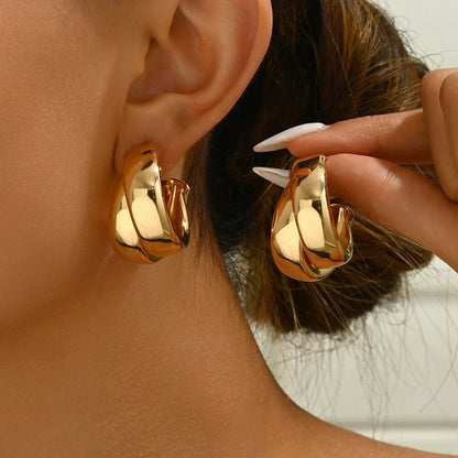 “Stainless Steel Chunky Hoop Earrings - Gold Double Ring Geometric Design.”