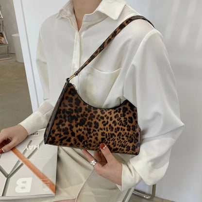 “Trendy zebra-print shoulder bag, PU leather, chic design, perfect summer accessory.”
