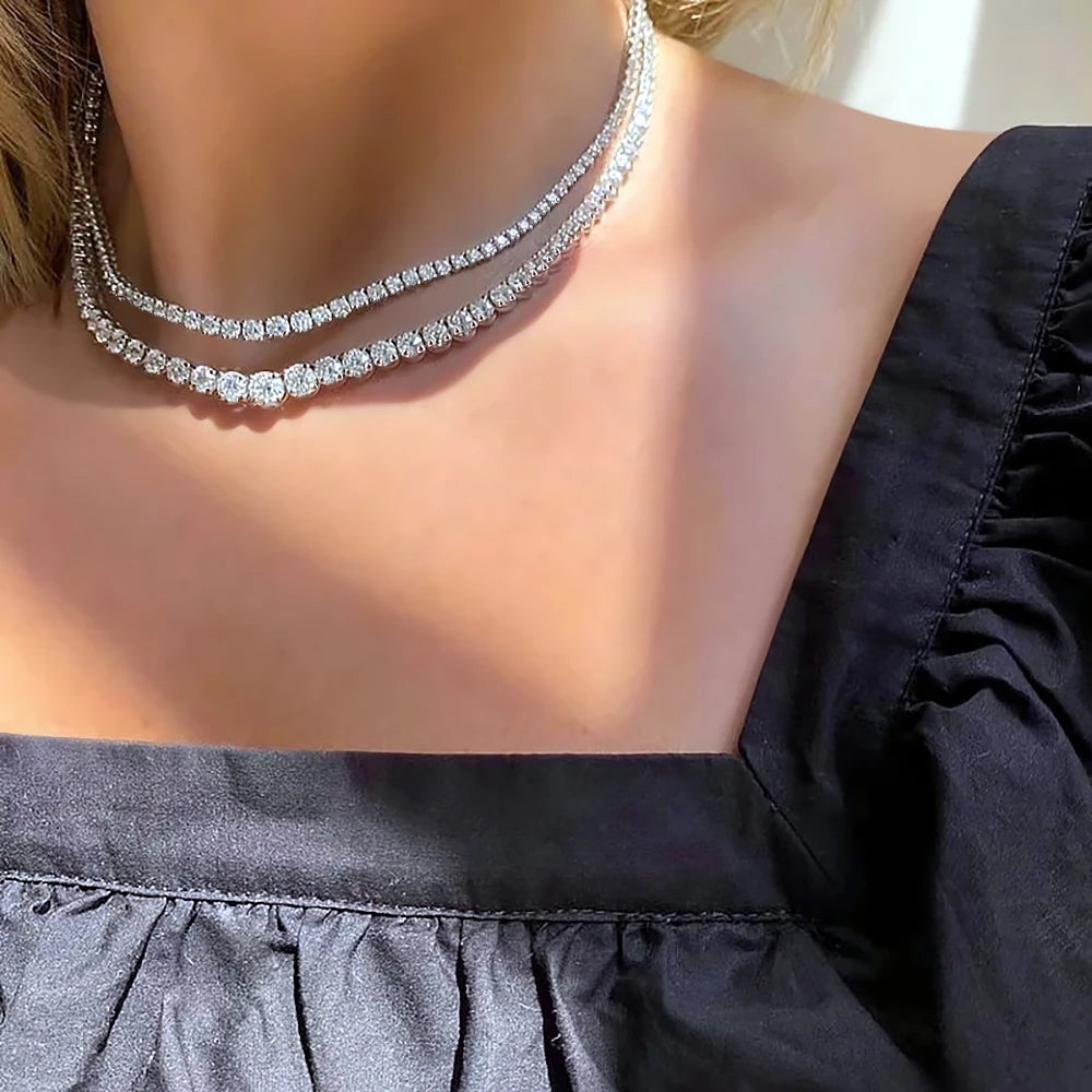 “Moissanite tennis necklace, 3-5mm gradient stones, 925 silver, certified luxury design.”