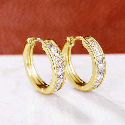 “Classic hoop earrings with princess-cut CZ, elegant and versatile women’s accessories.”