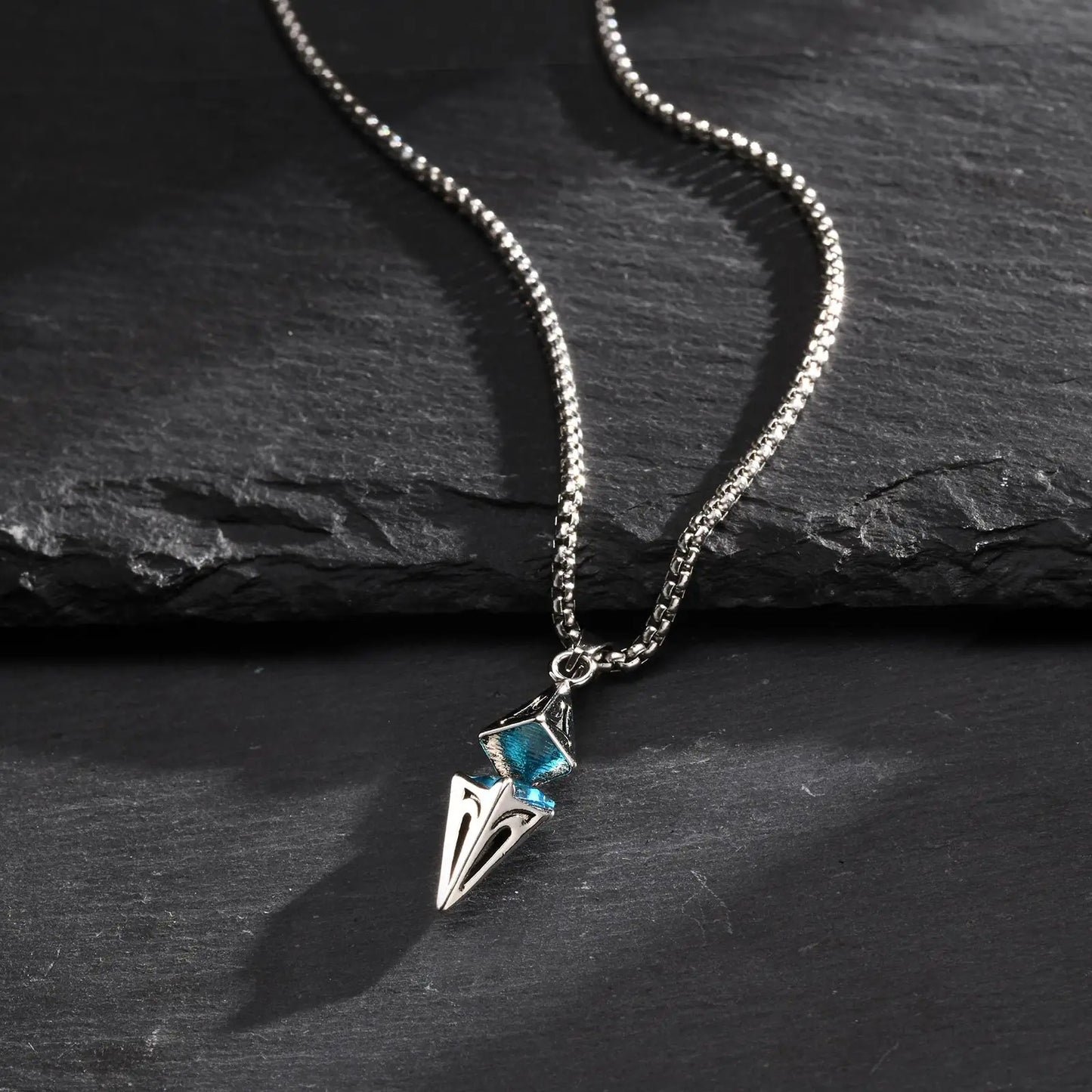 “Stylish Blue Stone Necklace for Men & Women - Stainless Steel Geometric Pendant.”