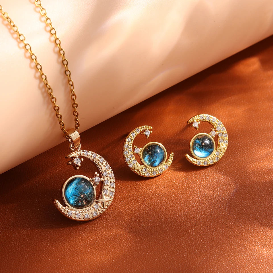 “Luxury gold titanium steel necklace with planet, moon, astronaut pendants.”